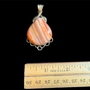 Sterling silver pendant. No chain included. EUC. Very nice addition great color